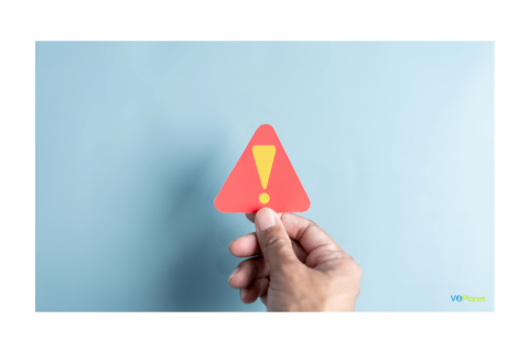 What If My Voice Over Has a Mistake A hand holding a red triangle with a yellow exclamation mark on a blue background