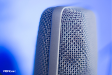 Close up of a microphone on a blue background Voice Over Genres