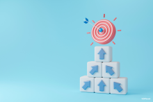 blue arrows on white cubes pointing up towards a red target with a blue arrow in the bullseye